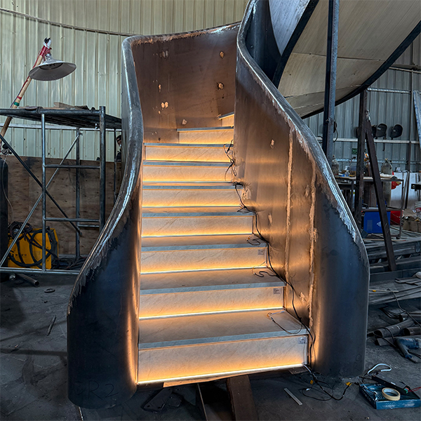 Curved staircase with thick stringer for villa.