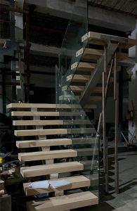 Stainless steel mono staircase, Custom built wooden tread stairs.
