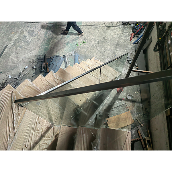 modern floating staircase with glass railing in USA